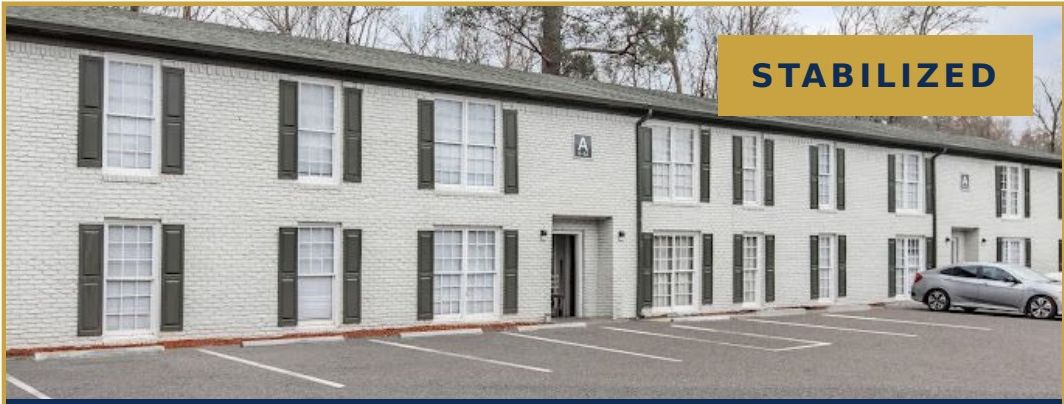 Magnolia Gardens — white brick multifamily community in Thomaston, Georgia